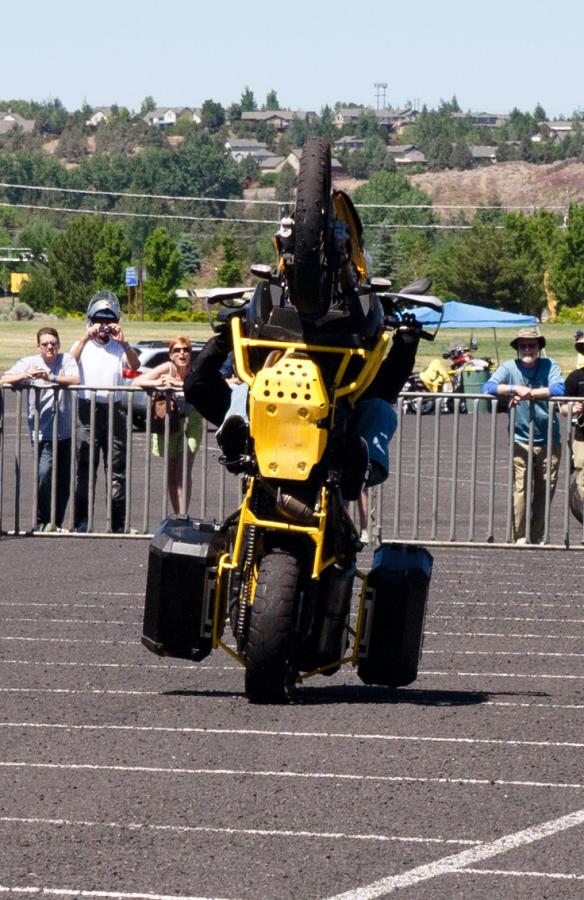 P1020033.jpg - After warming up on a G650, McNeil moved up to an F800GS on which he proceeded to drag the top case during this giant wheelie.