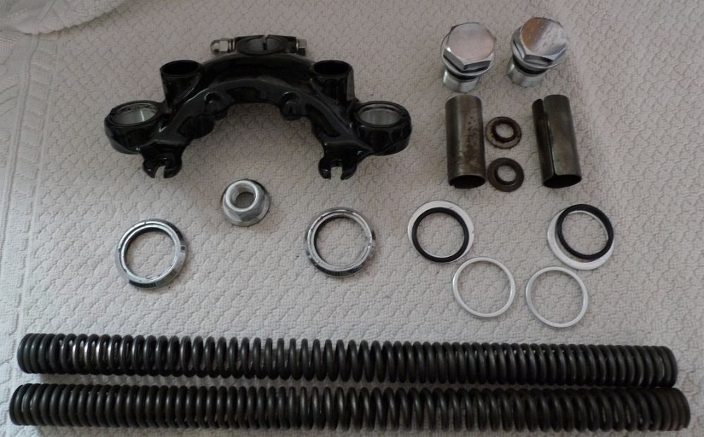L1000835.jpg - Top triple clamp and fork parts ready for assembly.