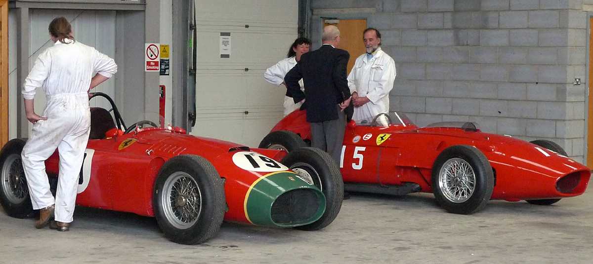 L1010925.JPG - A pair of Ferrari GP cars. Everybody else was out in the semi-covered paddock, but these guys had a private garage. Very much like Il Commendatore.